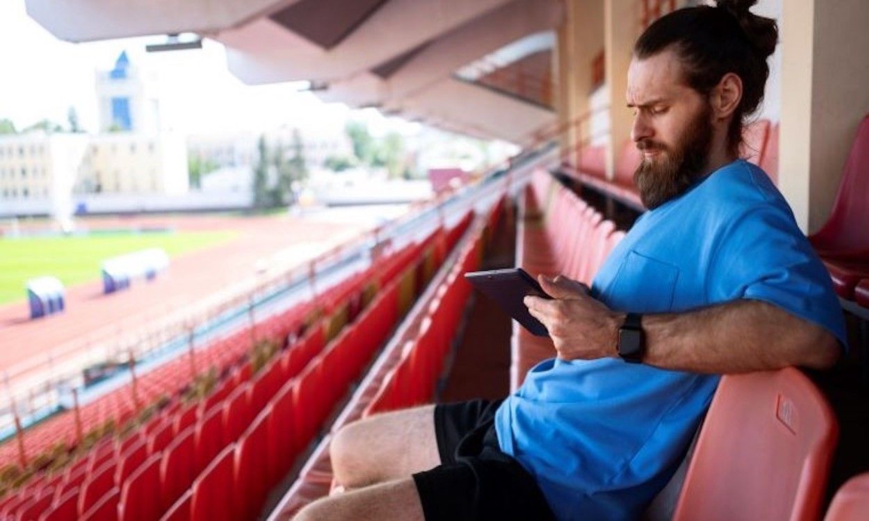 side view man holding tablet