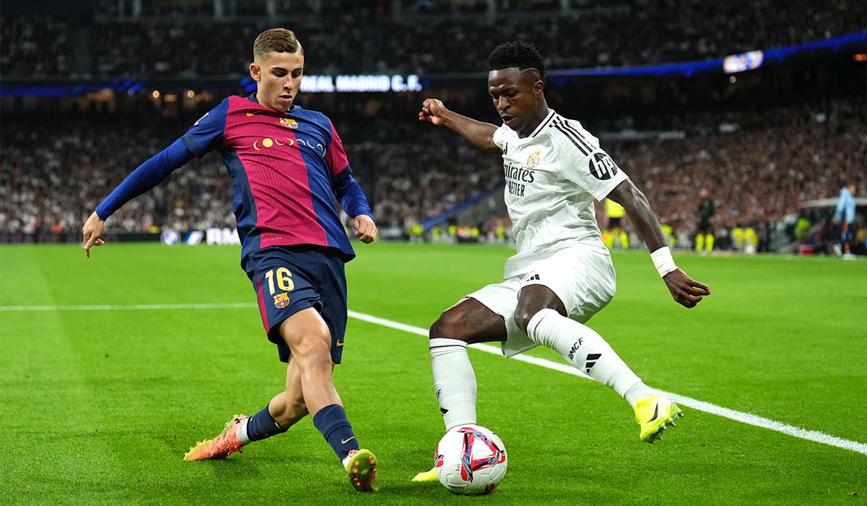 Fermín López disputando un balón con Vinicius Jr.