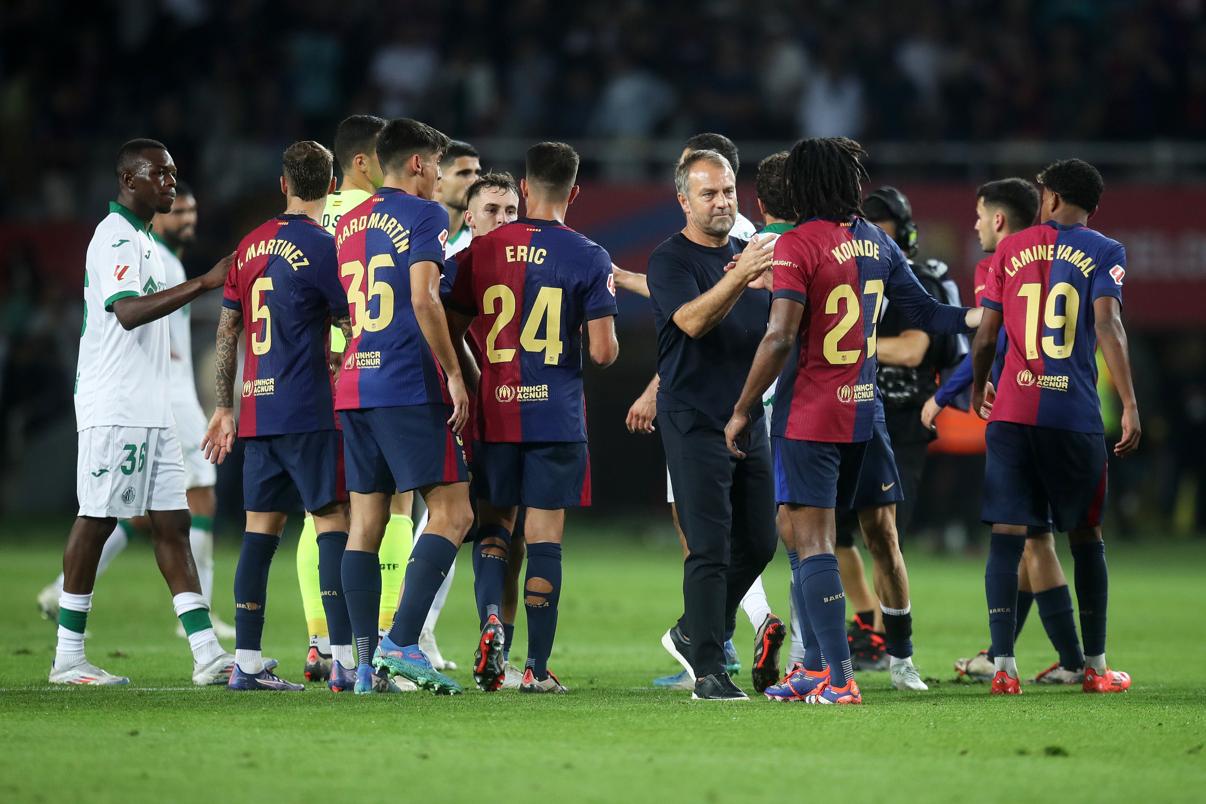 Hansi Flick greeting his players after a Barça match